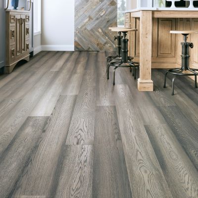 waterproof LVP floors in a Saskatoon kitchen with wood island and stools